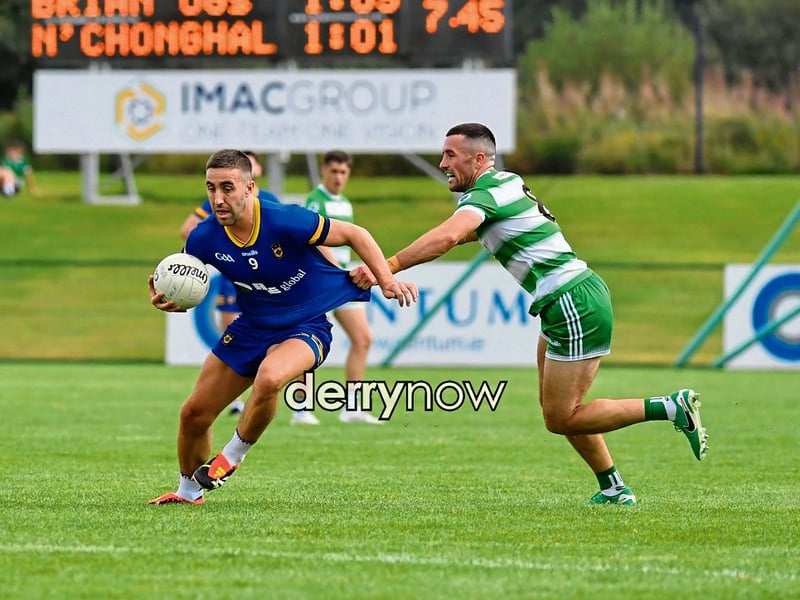 Jordan Curran of Faughanvale gets a grip on Steelstown’s Ryan Devine.