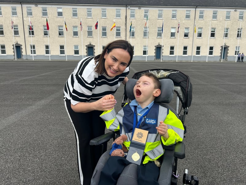 There was smiles and laughter in abundance at Templemore Garda College, as 31 new Gardaí were conferred as part of the Little Blue Heroes foundation, August 19. Families and spectators were treated to a marching performance from the Garda class of 2025, intake 244 - who are set to graduate themselves on Friday, August 22. Children and teenagers with serious illnesses received honorary degrees and badges. Comedian and actor Pat Shortt was in attendance at the event representing the Blue Knights motorcycle club, to the delight of many parents along with the new honorary Gardaí. Paw Patrol and Minnie Mouse also hit the scene and proved to be very popular with the Little Blue Heroes. READ MORE: Ever hear of a split mortgage? Third option for homebuyers in fixed vs variable debate The Gardaí have raised one million Euro for the Little Blue Heroes, according to the charity’s co-founder Alan Roughneen. One parent said that while financial assistance for families with serious illnesses is a part of the Little Blue Heroes, the Gardaí are extremely subtle about fundraising, and never do so in front of the children. The charity also runs a buddy program, where an assigned volunteer Garda will regularly visit a family they are paired with. After a parade which featured motorcycles, Garda escorts and of course the new honorary recruits, Alan Roughneen gave a speech thanking the Little Blue Heroes for their “ongoing engagement and friendship with our Garda Buddies” saying that their effort is “what makes our honorary Garda program work”. The Little Blue Heroes Foundation was established in 2017, and is a charity led by Garda members, retired Garda members and people from local communities on a voluntary basis.