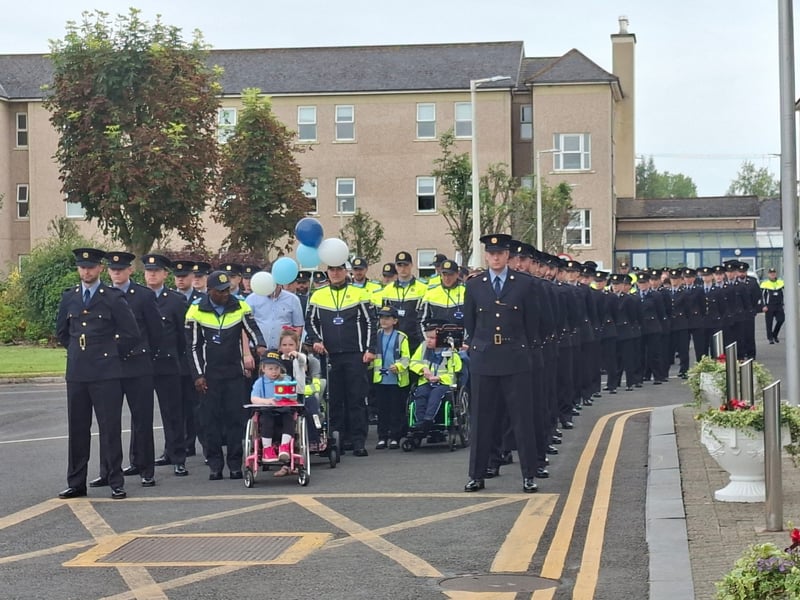 There was smiles and laughter in abundance at Templemore Garda College, as 31 new Gardaí were conferred as part of the Little Blue Heroes foundation, August 19. Families and spectators were treated to a marching performance from the Garda class of 2025, intake 244 - who are set to graduate themselves on Friday, August 22. Children and teenagers with serious illnesses received honorary degrees and badges. Comedian and actor Pat Shortt was in attendance at the event representing the Blue Knights motorcycle club, to the delight of many parents along with the new honorary Gardaí. Paw Patrol and Minnie Mouse also hit the scene and proved to be very popular with the Little Blue Heroes. READ MORE: Ever hear of a split mortgage? Third option for homebuyers in fixed vs variable debate The Gardaí have raised one million Euro for the Little Blue Heroes, according to the charity’s co-founder Alan Roughneen. One parent said that while financial assistance for families with serious illnesses is a part of the Little Blue Heroes, the Gardaí are extremely subtle about fundraising, and never do so in front of the children. The charity also runs a buddy program, where an assigned volunteer Garda will regularly visit a family they are paired with. After a parade which featured motorcycles, Garda escorts and of course the new honorary recruits, Alan Roughneen gave a speech thanking the Little Blue Heroes for their “ongoing engagement and friendship with our Garda Buddies” saying that their effort is “what makes our honorary Garda program work”. The Little Blue Heroes Foundation was established in 2017, and is a charity led by Garda members, retired Garda members and people from local communities on a voluntary basis.
