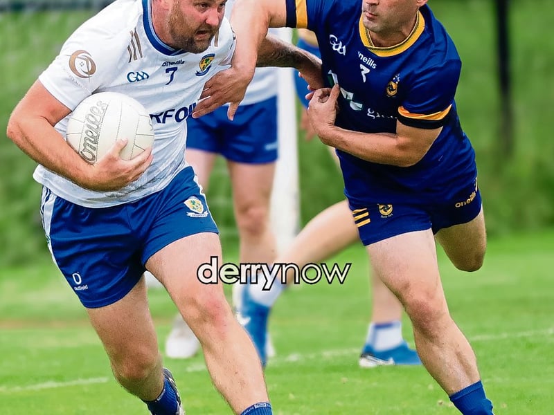 Ballinderry Darren Lawn tackled by Steelstown Brian Ogs Gareth Logue.