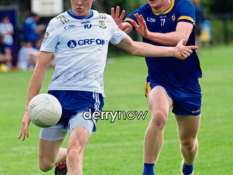 Ballinderry Jack Bell on his heels Steelstown Brian Ogs Ronan Canavan. (Photos - Tom Heaney, nwpresspics)