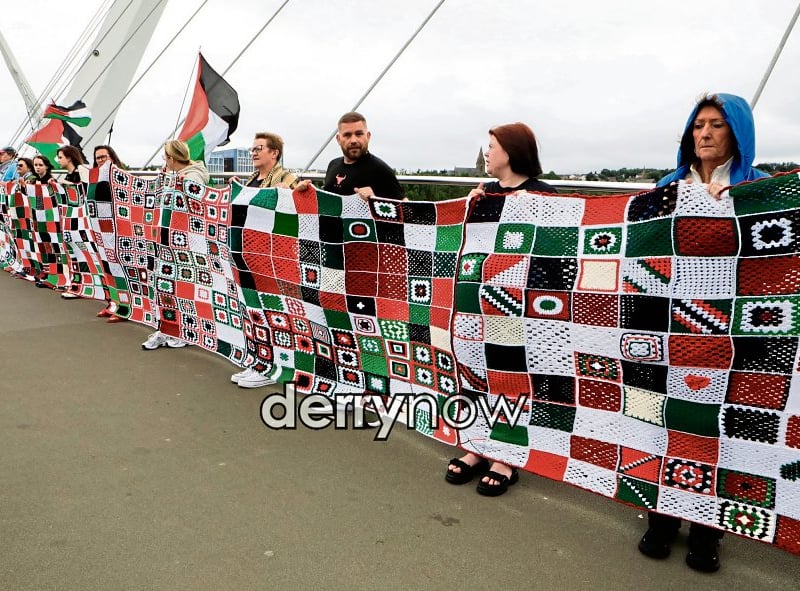 Derry's newly formed RISE for Palestine organisation, with those who created the Granny Squares for Gaza quilt on the Peace Bridge on Tuesday.