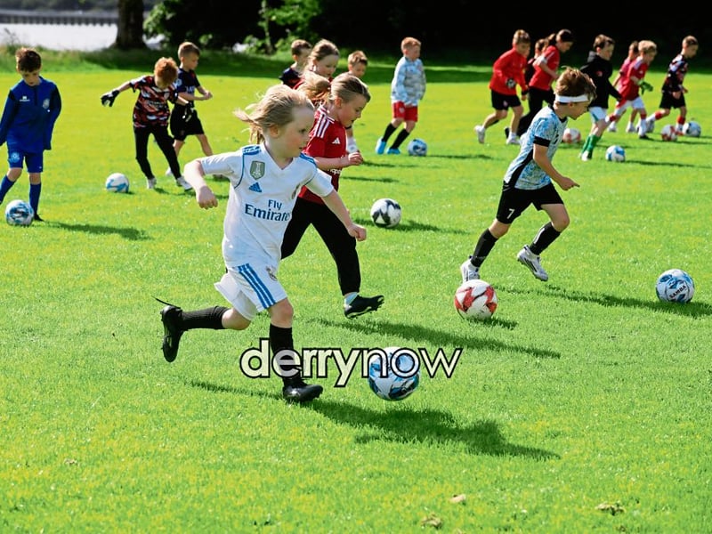 Young footballers on the attack at the Culmore Football Club, Ryan McBride Summer Camp.