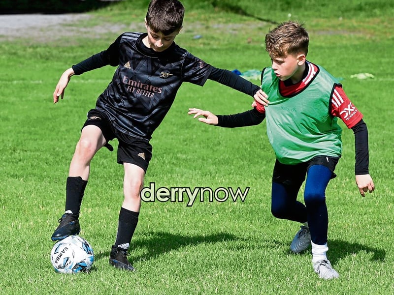 Young footballers taking part in a game at the Culmore Football Club, Ryan McBride Summer Camp.