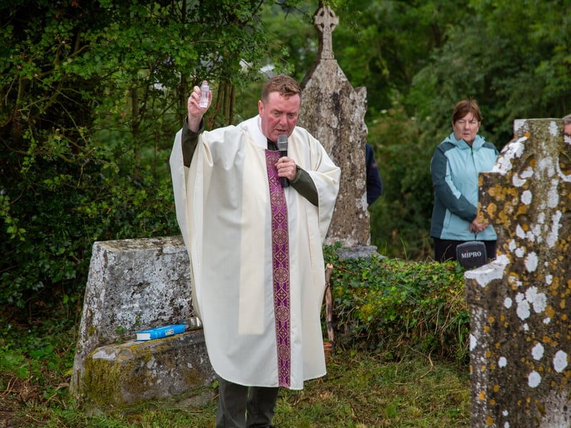A cemetery mass has been held in a Laois graveyard for the first time in over 100 years. Photos by Stephen Murphy. It is not known exactly how old Kilcronan cemetery in Ballinakill is, with the oldest headstone in the graveyard dated 1758. It has been over 100 years since a cemetery mass was held in the graveyard, and over ten years since the graveyard was cleaned up. The parish council recently organised the clean up of the graveyard, with help from local man Patrick O'Meara. Fr Paddy Byrne blessed the graves and the graveyard, with over 74 locals in attendance. "The cemetery mass went very well, there was a huge crowd," Chair of Ballinakill's Parish Council, Mr Patrick McDonnell told the Leinster Express / Laois Live. "It had been ten years since the last time the graveyard was cleaned up, and it was over thirty years the time before that. This was also the first graveyard mass to be held in over 100 years," Mr McDonnell explained. "There are a couple of hundred people buried in the graveyard. Years and years ago, there were bodies washed away in a flood, with coffins seen floating down the river," he said. "The last person to be buried here was in 1993." The parish council have said that they intend to hold a graveyard mass in Kilcronan every year, from now on. Located on the west bank of the Owenbeg river, the graveyard contains ruins of a medieval church and monastery associated with St Cronan. The graveyard contains ruins of medieval church marked on an 1841 Ordinance Survey map as 'Kilcronan Church (in ruins)'. The ruins of this monastery are fragmented, consisting simply of parts of the west gable and south wall. Read Next: Curtain call: Portlaoise arts centre announces change in leadership