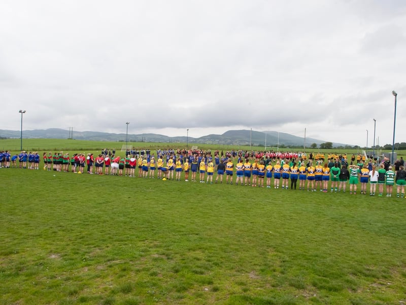 Ladies line up for the National Anthem during Saturday's event at Beart GAC.