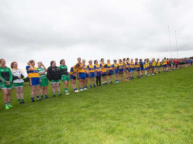Ladies line up for the National Anthem during Saturday's event at Beart GAC.