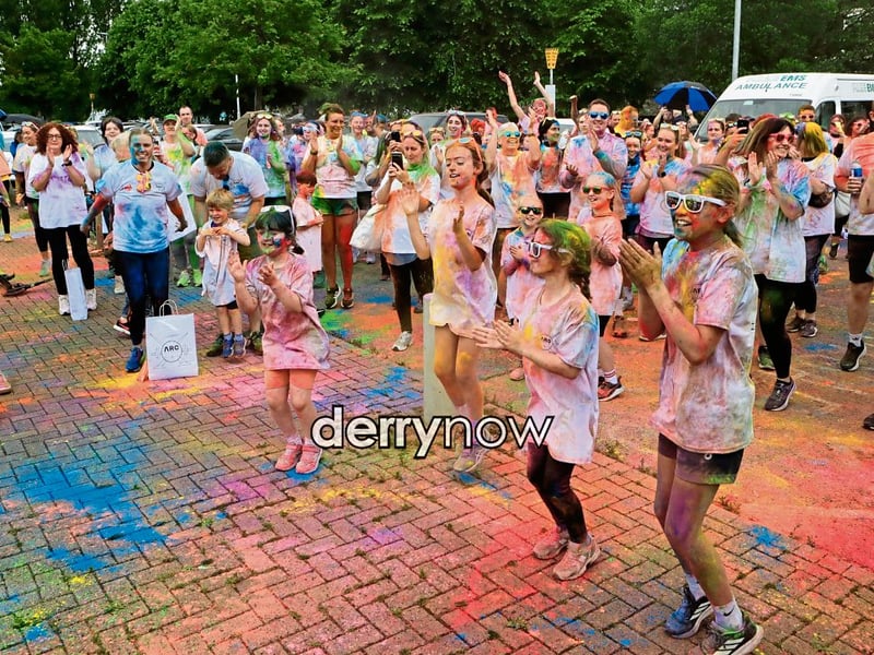 Participants taking part in the “warm-up” before the start of the ARC Fitness 3k Colour Dash.
