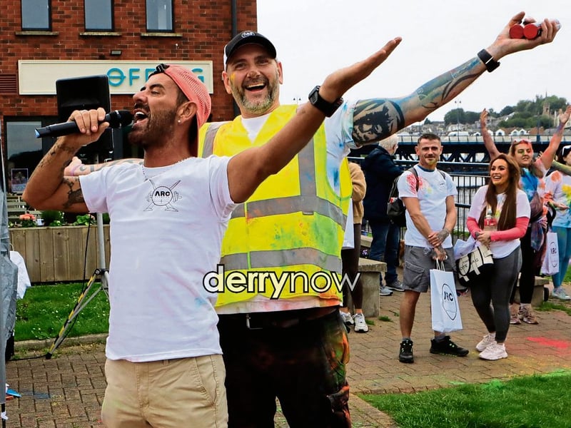 Local celebrity Mickey Doherty leading the “warm-up” belting out ‘YMCA” with Gary Rutherford, founder ARC Fitness, before the start of the ARC Fitness 3k Colour Dash.