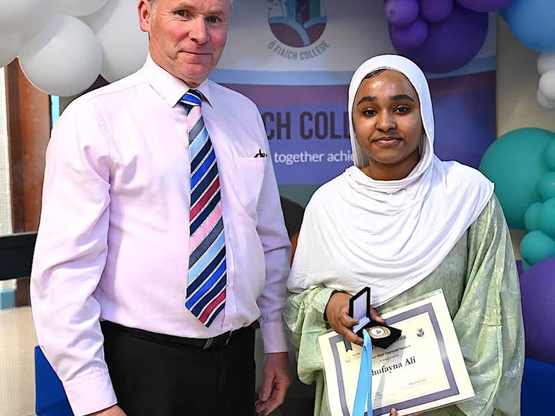 Below: Most Improved Student award winner Shufayna Ali receives her award from Deputy Principal John Caraher