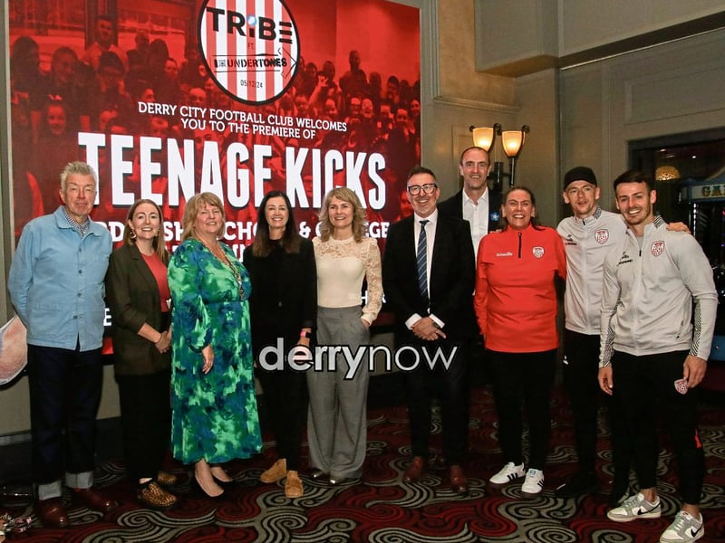 Group pictured with the Deputy Mayor Niree McMorris and Undertones bass guitarist Mickey Bradley, at the film “Teenage Kicks”, by the late Vinny Cunningham at Brunswick Moviebowl. Included, from right are Derry footballers, Danny Mullan and Ciaron Harkin, Karen Payne, Mark H. Durkan, MLA, Raymond McFeeters, principal, Ardnashee College,, Julie McDevitt, vice-principal, Sinead McCrossan, vice-principal, and second from left, Colr. Grace Uí Niallais.