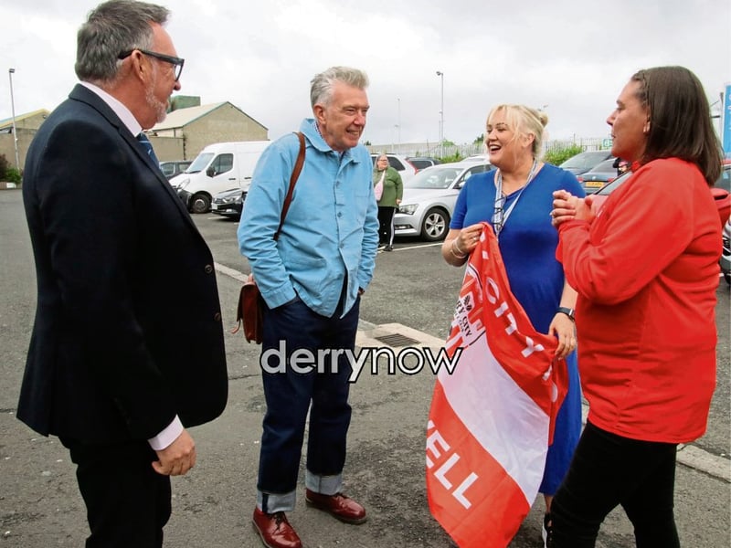 Undertones bass guitarist, Michael Bradley arriving for film “Teenage Kicks”, by the late Vinny Cunningham outside Brunswick Moviebowl is greeted by Raymond McFeeters, principal, Ardnashee College, whose pupils feature in the film, and on right, Karen Payne and Brid Cutliffe, choir director, Ardnashee College.