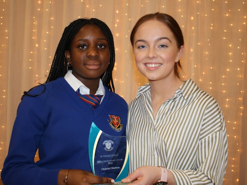 Below: Eimear Casey presents The Junior Mathematics Award to Cheluchi Obiefuna