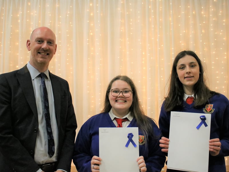 Below: Ashley Thompson presents The Poetry Aloud Award to Ella Brown and Dearbhla McArdle