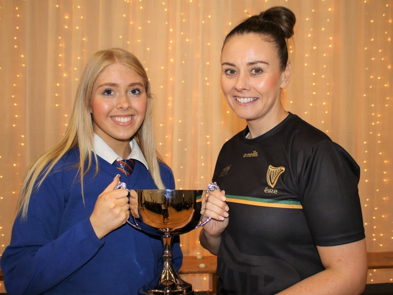 Below: Elizabeth McNulty presents The Senior Physical Education Award to Grainne Moran