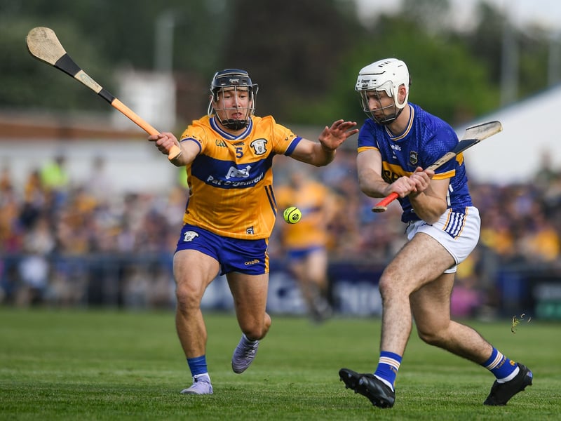 The Clare hurlers' All-Ireland title defence could end as early as next weekend after Brian Lohan's side lost to Tipperary in an epic encounter in Ennis on Saturday evening.  The Banner remain winless in this year's Munster SHC with just one match left - against Limerick on Sunday, May 25. Having trailed by 12 points at Zimmer Biomet Páirc Chíosóg, Clare rallied in the second half and drew level with Tipperary before Liam Cahill's side mounted a response to ensure a three-point victory. In front of just over 20,000 supports, the final score was Clare 2-21 Tipperary 4-18. While Clare don't play next weekend, the results of the Tipperary v Waterford and Limerick v Cork matches will determine the stakes for the final weekend of this year's Munster SCH. READ NEXT: Former Clare hotelier lands key role as Shannon Chamber confirms new appointment Clare need a freak combination of results to go their way and will have to beat Limerick at TUS Gaelic Grounds to have any chance of progressing to the All-Ireland series. PICTURES: Sportsfile