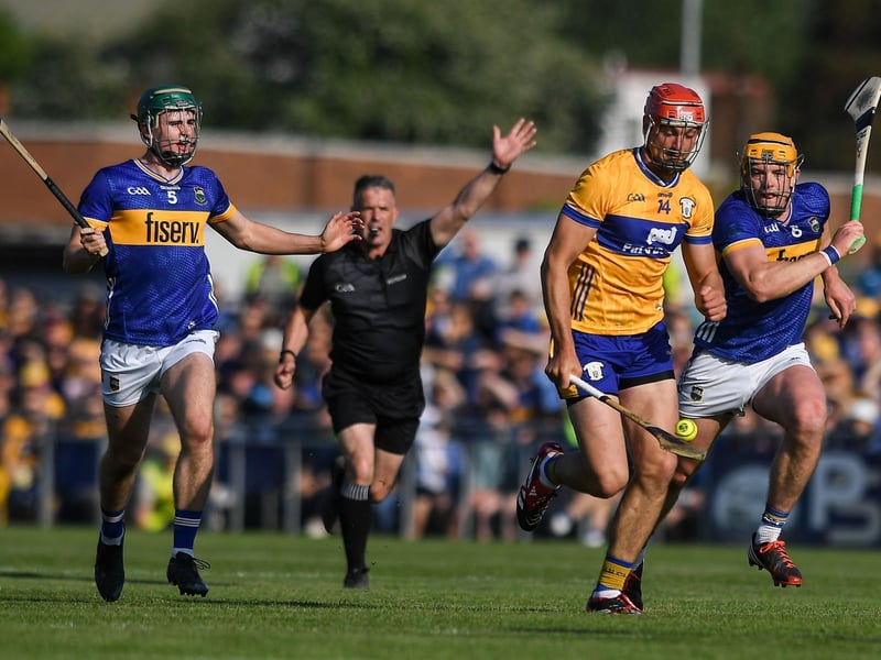 The Clare hurlers' All-Ireland title defence could end as early as next weekend after Brian Lohan's side lost to Tipperary in an epic encounter in Ennis on Saturday evening.  The Banner remain winless in this year's Munster SHC with just one match left - against Limerick on Sunday, May 25. Having trailed by 12 points at Zimmer Biomet Páirc Chíosóg, Clare rallied in the second half and drew level with Tipperary before Liam Cahill's side mounted a response to ensure a three-point victory. In front of just over 20,000 supports, the final score was Clare 2-21 Tipperary 4-18. While Clare don't play next weekend, the results of the Tipperary v Waterford and Limerick v Cork matches will determine the stakes for the final weekend of this year's Munster SCH. READ NEXT: Former Clare hotelier lands key role as Shannon Chamber confirms new appointment Clare need a freak combination of results to go their way and will have to beat Limerick at TUS Gaelic Grounds to have any chance of progressing to the All-Ireland series. PICTURES: Sportsfile