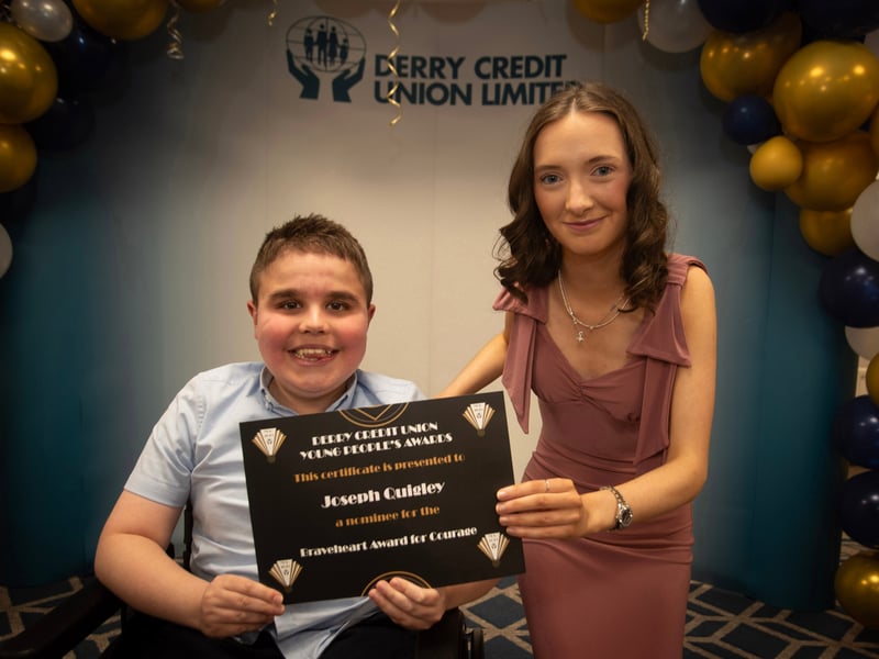 Derry Credit Union's Young People's Awards 2025 nominee Joseph Quigley, St. Columb's College, being presented with his Braveheart Award for Courage certificate by Ellen Bradley, Youth Committee, on Monday night.