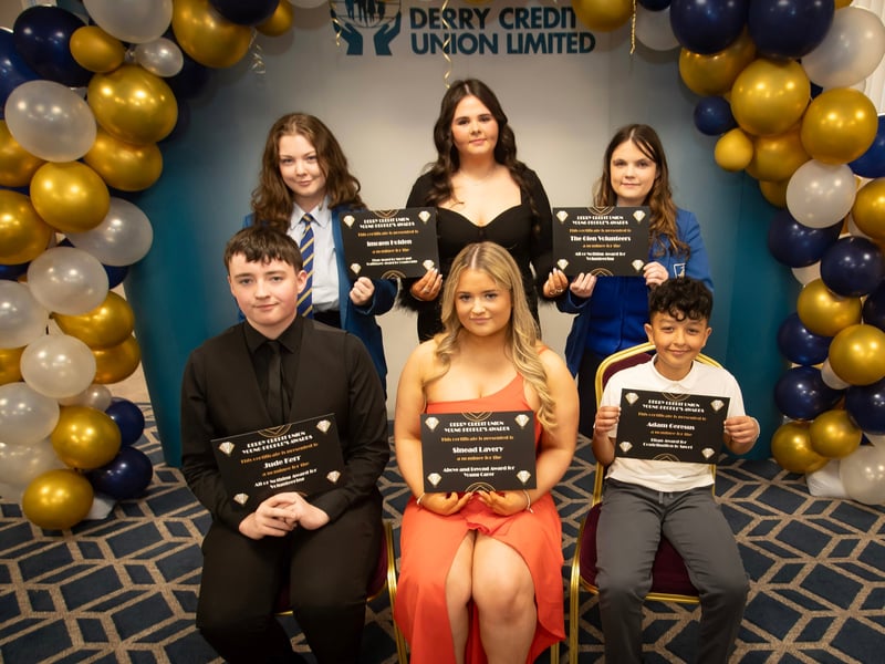 Derry Credit Union's Young People's Awards 2025 nominees being presented with their certificates by Abbie Doherty (centre, back), Youth Committee, on Monday night. At front are Jude Kerr, Sinead Lavery and Adam Geresus. At back are Imogen Holden and a representative from The Glen Volunteers.