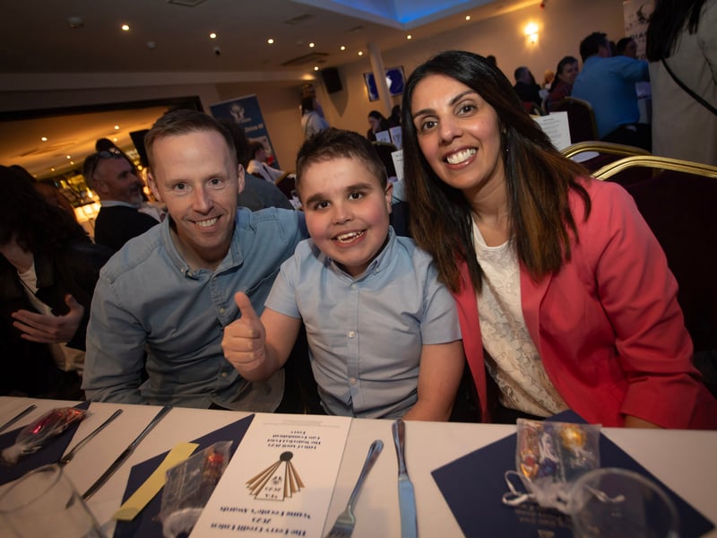 Young Joseph Quigley, a nominee for the Braveheart Award for Courage, pictured at the Derry Credit Union's Young People's Awards on Monday evening with his parents.