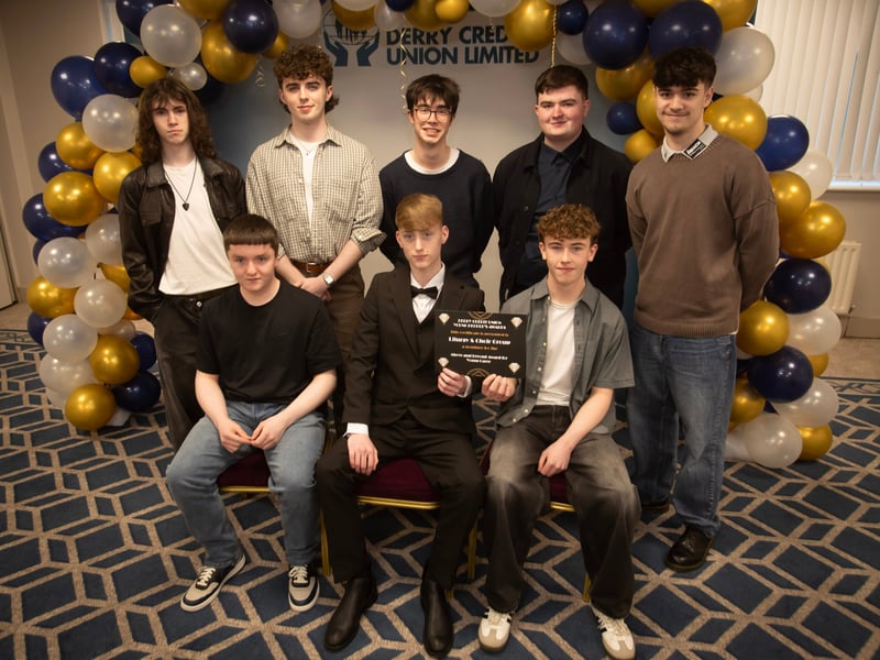 Derry Credit Union's Young People's Awards 2025 nominees the Liturgy and Choir Group, St. Columb's College, being presented with their certificates by Gary McLaughlin, Youth Committee, on Monday night.