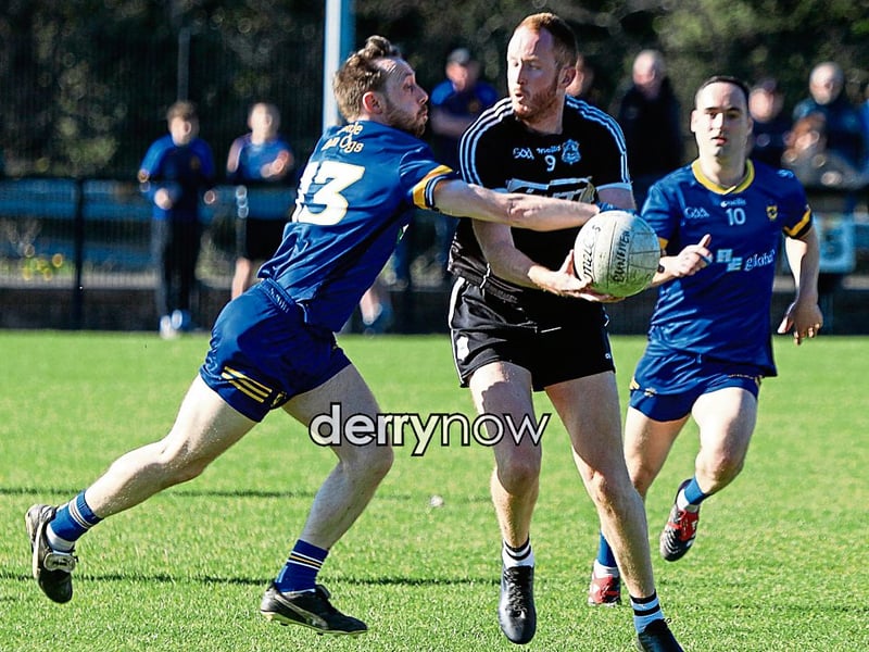 Steelstown's Neil Forrester puts a tackle in on Dungiven's Christy Sheerin. (Photos - Tom Heaney, nwpresspics)