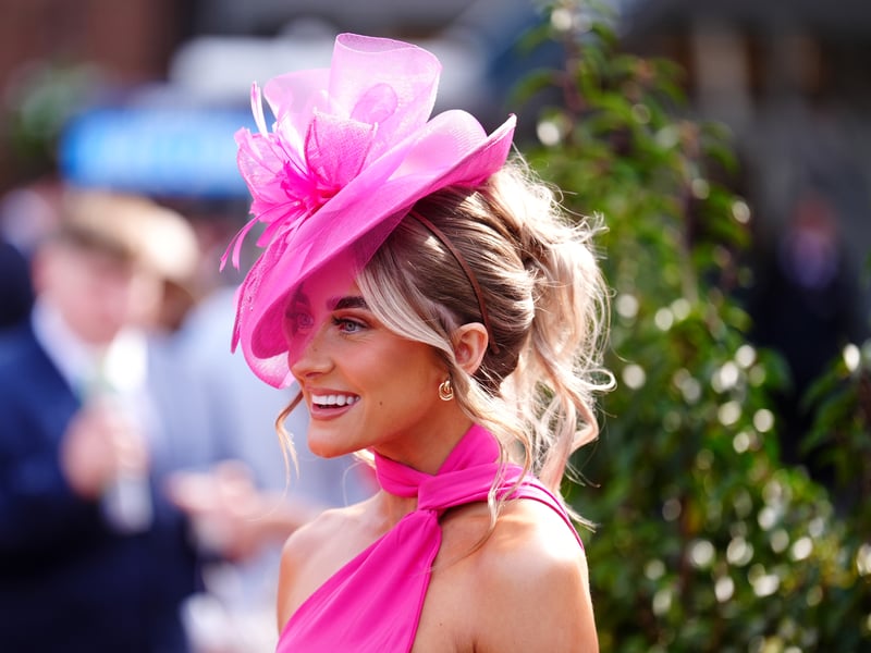 The three-day festival concludes on Saturday with the famed Grand National race.