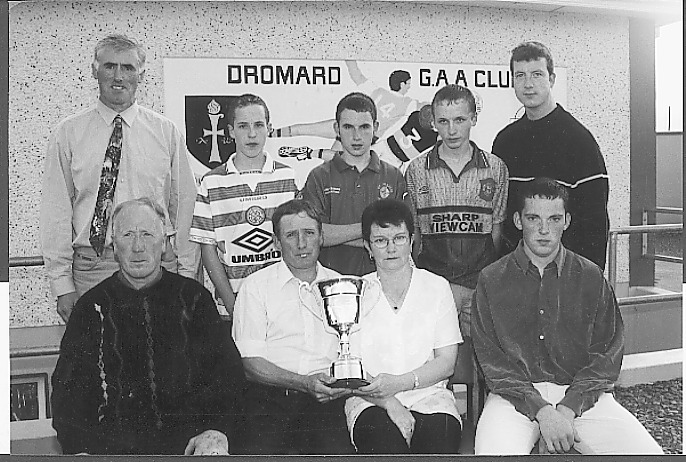 Dromard GAA Club presentation - Pictured at the presentation of the Francis Maguire Memorial Cup to the club were front row: Pat Jones with Noel and Marian Maguire and Edwin Brady with back row: Peter Mimnagh and Martin, Adrian, Noel and Anthony Maguire