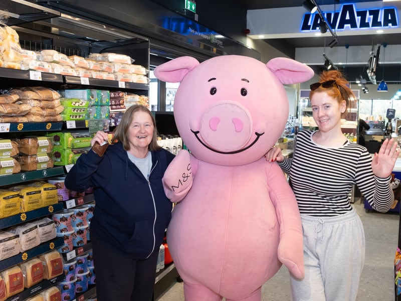 Percy Pig pictured with Anne McAra and Aisling Hurley, both from Waterford, pictured at the launch of Applegreen Lemybrien with M&S Food.