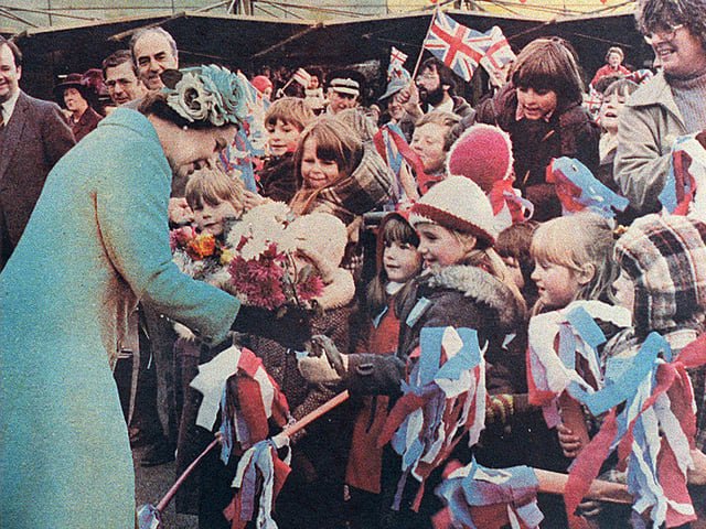 13 November 1981 — The Queen greets excited youngsters outside the Do-It-All store during her visit to open phase two of Telford town centre.