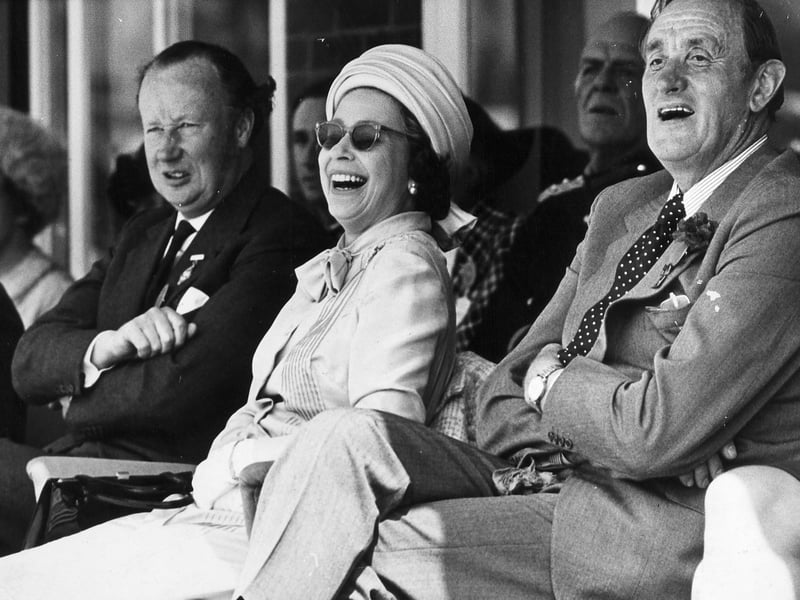 21 May 1975 — Her Majesty the Queen at the 100th West Mid Show, amused by a Shropshire pageant and a bucking bronco during her royal visit.