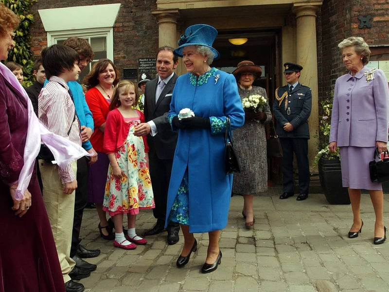 The Queen leaves the Royal Oak in Welshpool, with Lord Lieutenant of Powys, Shan Legge-Bourke, in 2010.