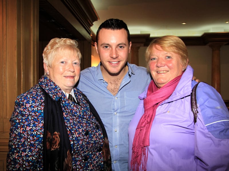 Caption: Marion Border and Deirdre Carr with country star Nathan Carter