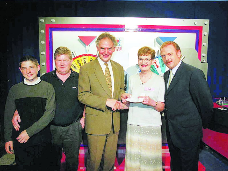 Caption: Clondra woman, Nell Clabby was one of the contestants on the National Lottery TV game show Fame & Fortune. She is seen here receiving her cheque for £20,000 which she won on the show. Included in the photograph are left to right: Oisin O’Connor and his father Noel from Newsround, Cathal McNally of the National Lottery, Nell Clabby and TV game show host Marty Whelan