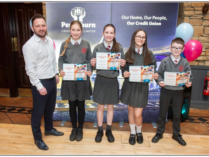 Holy Family PS pupils pictured with Pennyburn Credit Union Manager Frank Doherty.