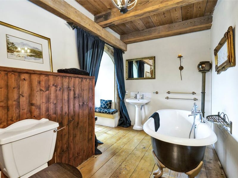 The third floor features a well-appointed bathroom complimented by a clawfoot rolltop bath tub.
