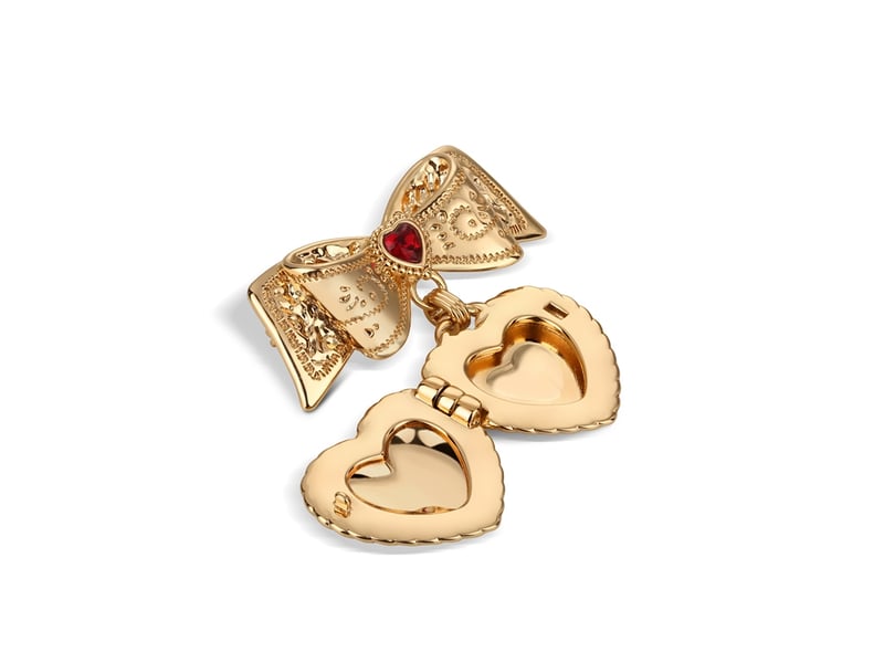 Heart Locket Brooch with Ruby Red Stones €40 Effortless elegance with this 14k gold plated heart locket brooch from Newbridge Silverware. This beautiful brooch is meticulously crafted with a lustrous finish featuring ruby red glass and crystal stone settings that add a touch of opulence to its design. A stunning meaningful gift that will be treasured for years to come.