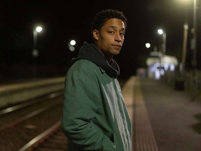 Better known for his music, Loyle Carner – who is credited as Ben Coyle-Larner in the show – makes his acting debut as Arran in Mint. Shannon’s love interest, his character is a member of a rival crime family, who Coyle-Larner describes as bringing a “delicateness” to the story. 
