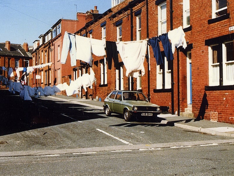 Brompton Row seen from Brompton Terrace in 1989. Houses in the foreground are numbered from 2 to 8, then above the gap of the (now defunct) lavatory yards are nos.10-16. Back Lodge Lane runs across the top of the street with the rear of houses addressed as Lodge Lane.
