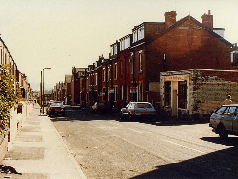 Looking east along Stratford Terrace from the Lodge Lane end down towards Lady Pit Lane. The houses on the right are back-to-backs with Brompton Row. The small brick building was a shoe repair shop.