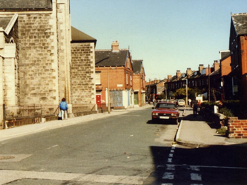 Lodge Lane, from the junction with Back Stratford Terrace. The building on the left is the Church of the Holy Spirit. The boarded-up shop after this is on the corner of Lodge Lane and Stratford Street, and in its heyday it was a pork butchers owned by the Leah family. It has since been demolished.