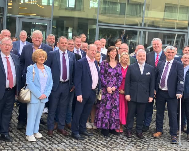 Galway County Councillor Noel Thomas (centre) and party leader Michael Collins surrounded by Independent Ireland supporters at the party’s convention in Galway City last weekend  
