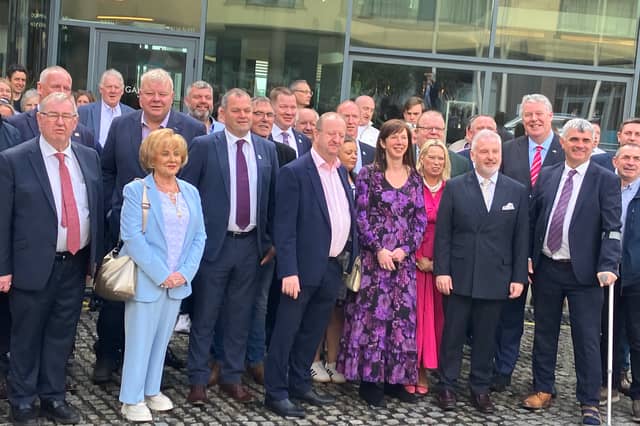 Galway County Councillor Noel Thomas (centre) and party leader Michael Collins surrounded by Independent Ireland supporters at the party’s convention in Galway City last weekend