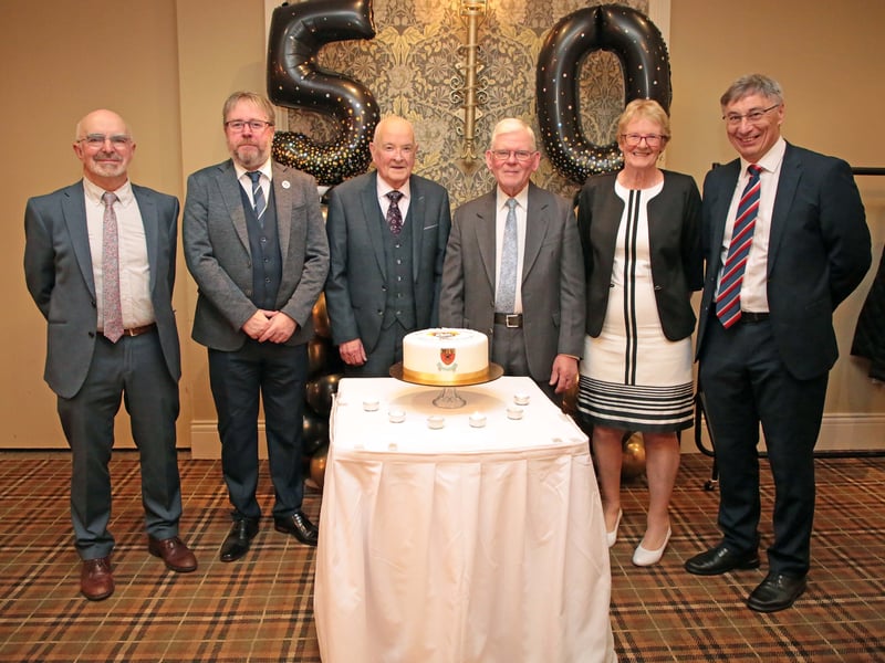 Caption: Liam Halpin, Des Cullen, James McNerney, Michael Denning, Margaret McGuckian and Paddy McPhillips with the Moyne Community School Golden Jubilee cake at last Thursday's gala dinner dance in the Breffni Arms Hotel, Arva