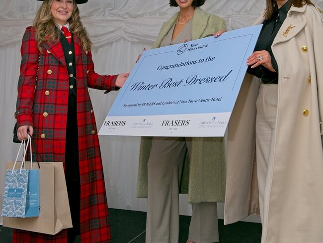 Winner of the Winter Best Dressed Cara Earls-Meehan is presented with her prize with judges Sarah McDermott and Mandy Maher.