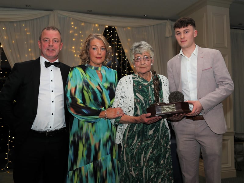 Caption: U21 player of the year Kaelum Gill receives the Jimmy Tully memorial trophy from Jimmy's mother Kathleen and sister Mary Mealy with Seamus Gallagher, Fr. Manning Gaels vice chairperson also in the picture. Photo: Syl Healy.