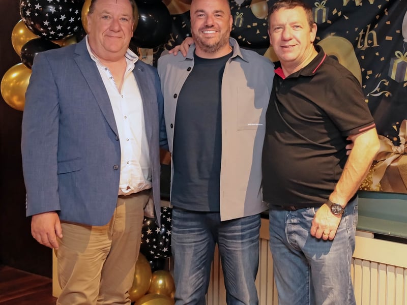 Caption: Kevin Hussey with Seamus and Mel Finn