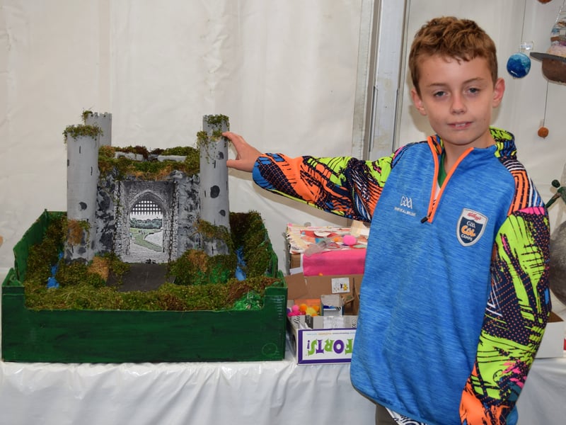Bobby Kinsella and Tadgh Mackey made this castle, Bobby proudly displays their end product.