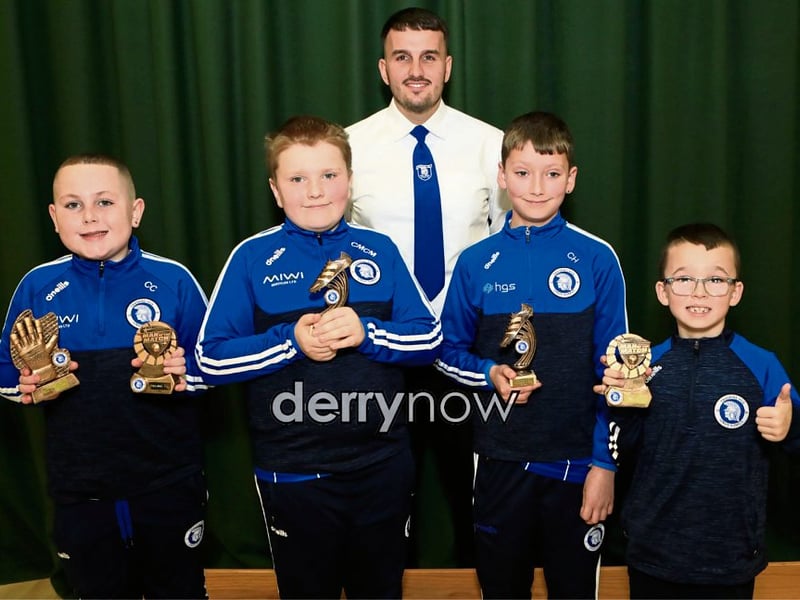 "Man of the Match" award winners, from left, are Calaeb Carlyle, Caleb McMenamin, Conar Hannigan and Sean Trusz with Diolain Ward at the Trojans Youth & Community Group Annual Youth Presentation of Awards held in St. Cecilia’s College.