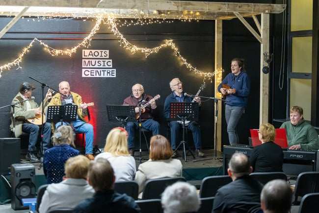 The Rathdowney Men's Shed performing with Denise Boyle at the Laois School of Music and Music Generation Laois Adult Students Christmas Concert in Laois Music Centre.